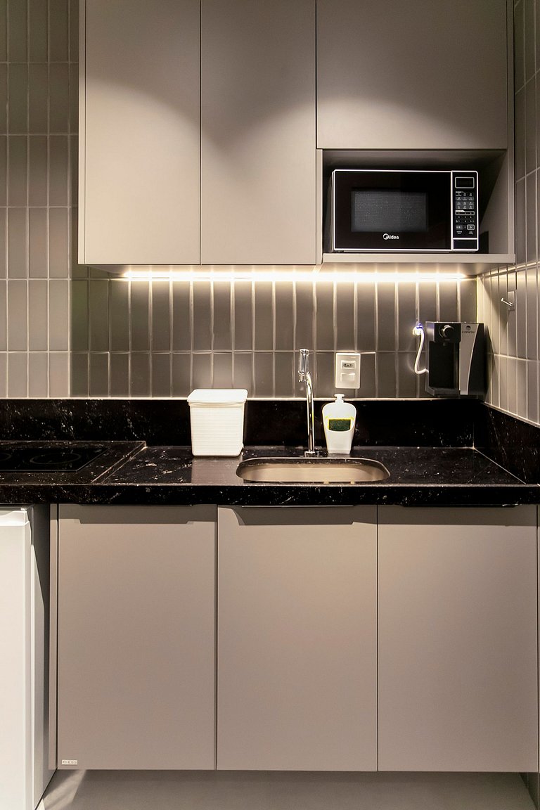 Studio com mini cozinha e vista