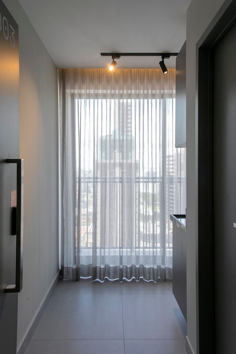 Studio com mini cozinha e vista